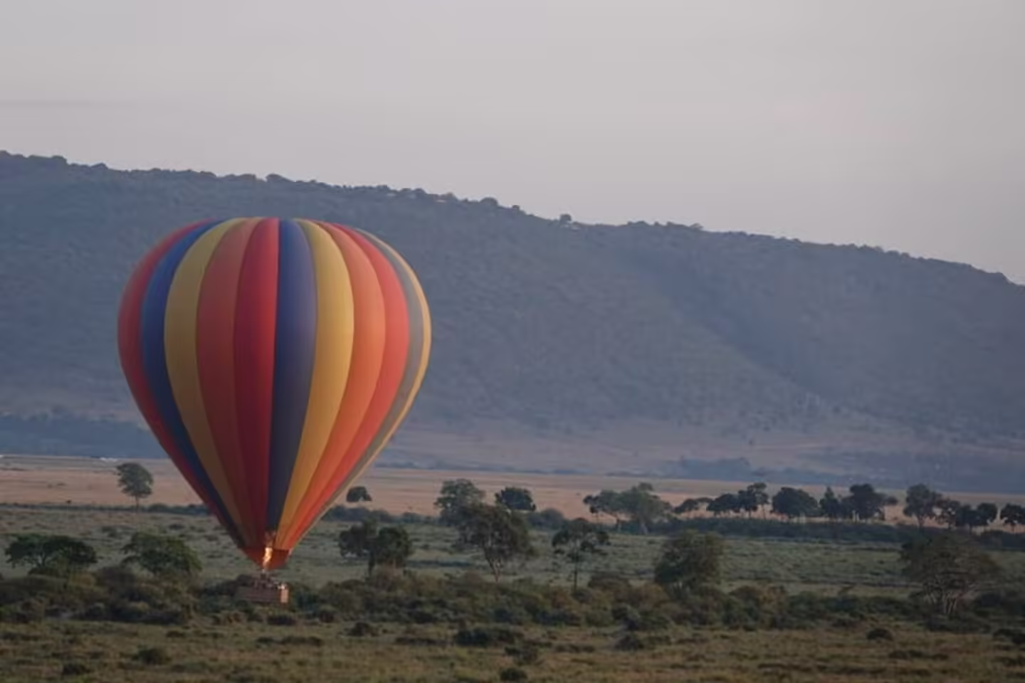 Hot air balloon with the masai mara beneath